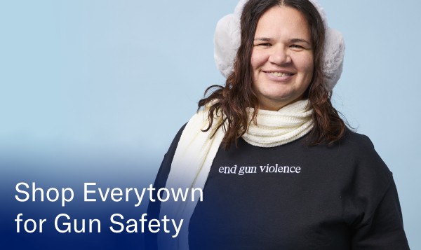 A photo of a model wearing a sweater that says 