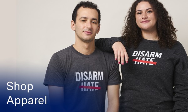A photo of two models wearing Everytown and Moms Demand Action apparel that reads 