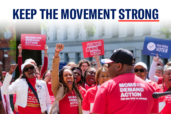 a photo of volunteers and supporters gathered in a crowd wearing their red "Moms Demand Action" shirt with copy that reads: "Keep the Movement Strong" on the top