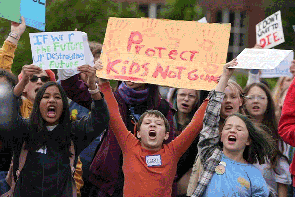 A gif of students from various campuses around the country walking out of class.